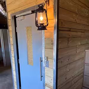 Rustic wooden hallway with a compass lift.