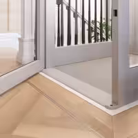 Modern home elevator interior with glass doors.