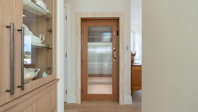 the door of a home lift in a warm and inviting home